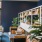 lobby with deep blue walls and books on shelves at The Winnie Uptown Chicago Apartments