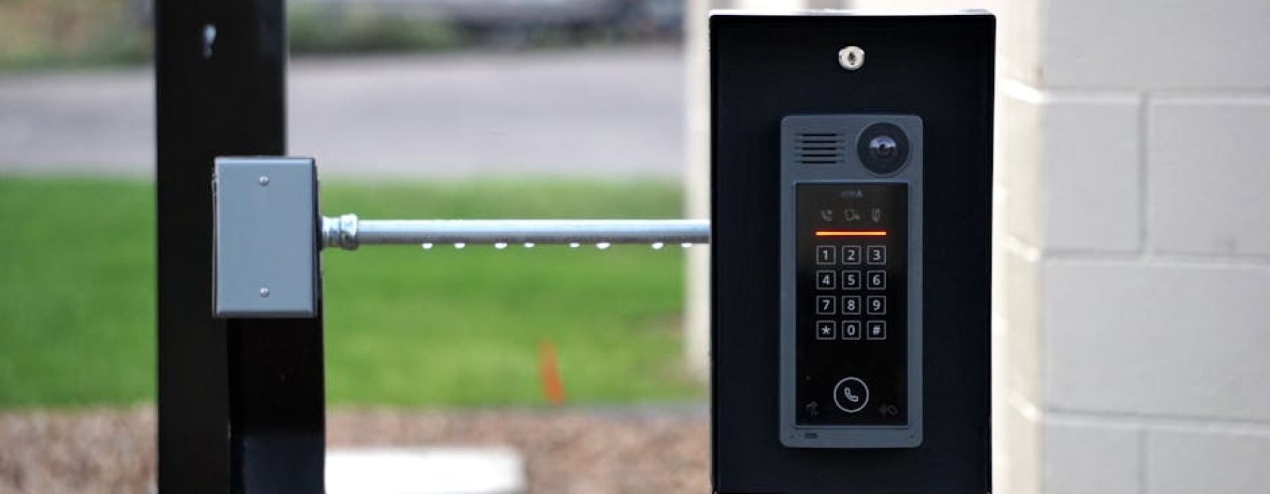 modern apartment building entrance with security access panel - apartments with controlled access