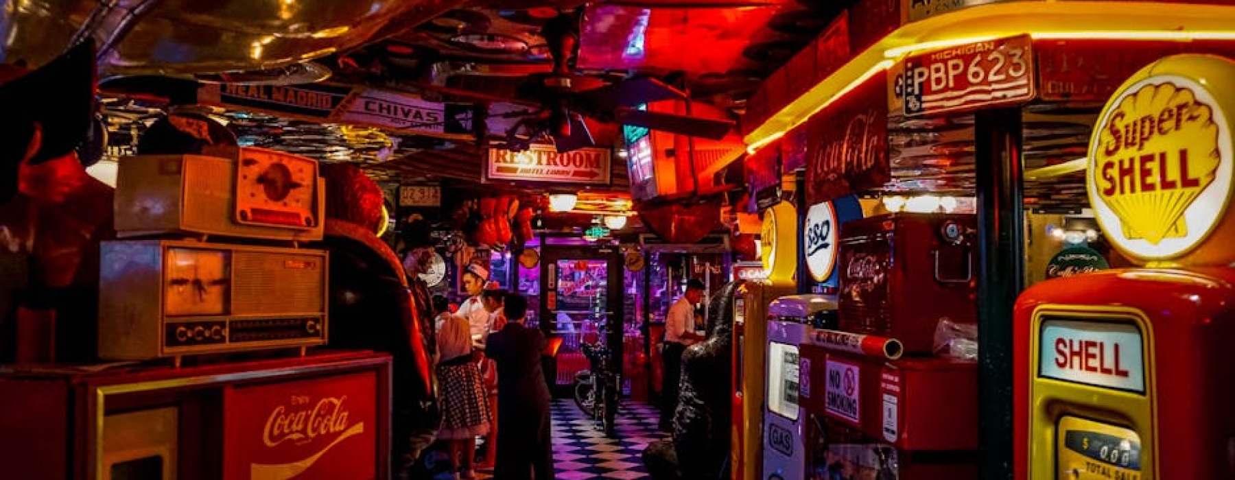 people playing arcade games at a bar - bar and games near me